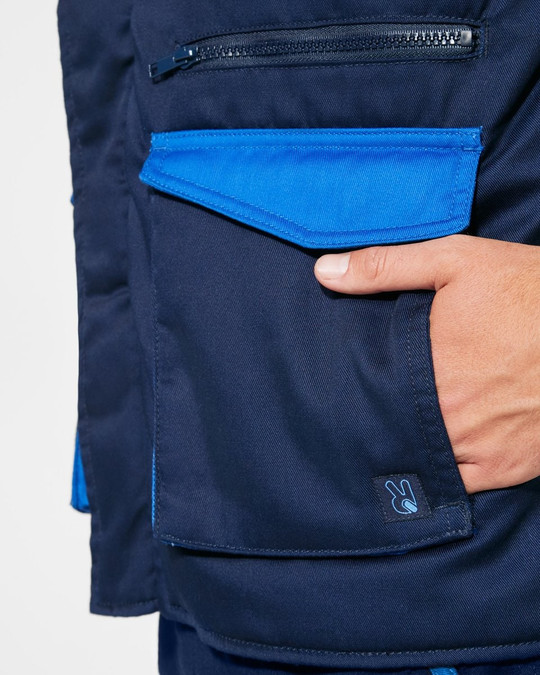 Roly CQ8414 - ARMADA Padded multi-pocket work vest with extended back