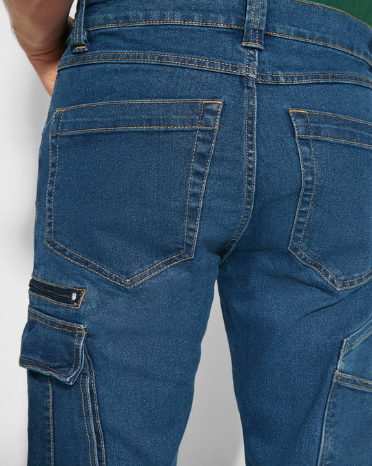 Roly PA8402 - RAPTOR Pantalon long en jean multi-poches avec coutures latérales légèrement sur le devant