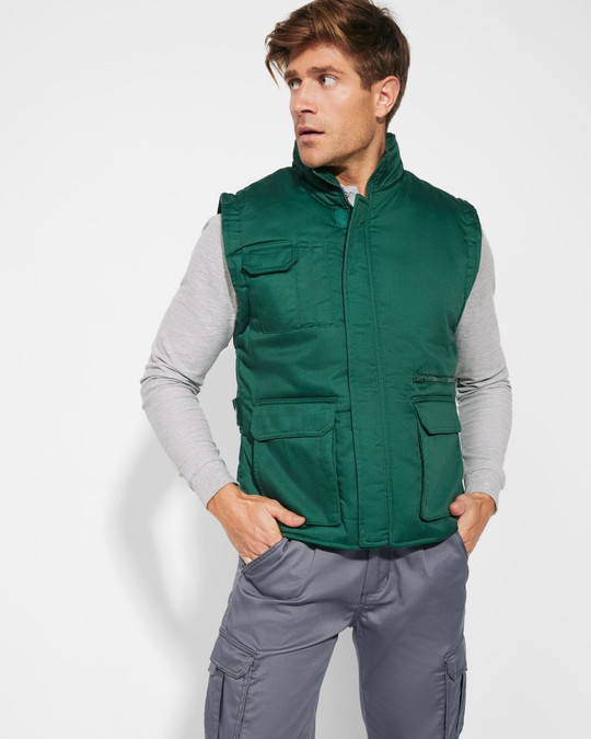 Roly CC5067 - ALMANZOR Gewatteerde werkbodywarmer met meerdere zakken en verlengde achterkant