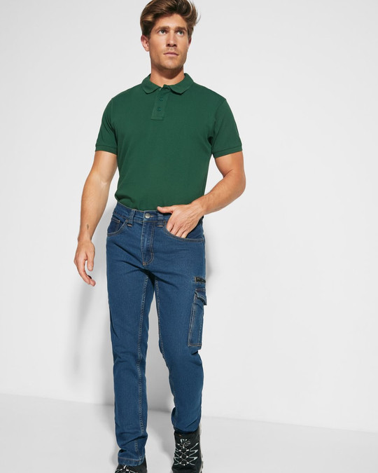 Roly PA8402 - RAPTOR Pantalon long en jean multi-poches avec coutures latérales légèrement sur le devant
